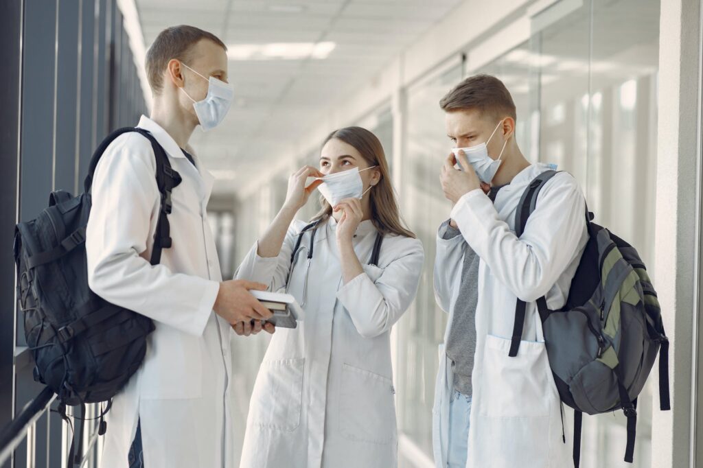 group of medical students at the hallway wearing face mask